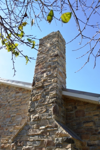 Stone chimney on colonial renovation in Clear Spring, MD by Mt. Tabor Builders, Inc.