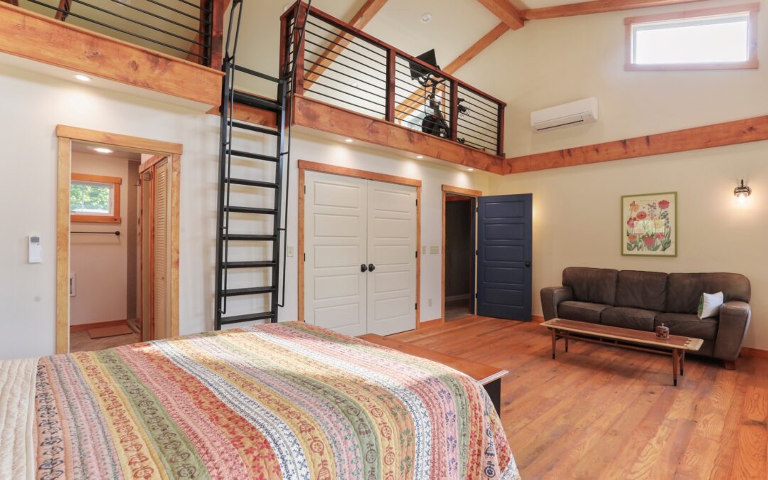 Timber frame house bedroom by Mt. Tabor Builders